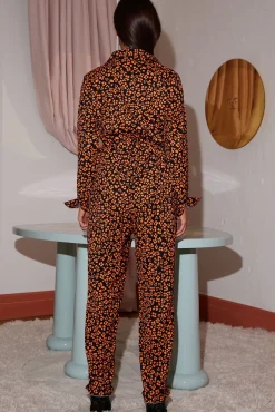 Roxanna Jumpsuit In Orange On Black Leopard