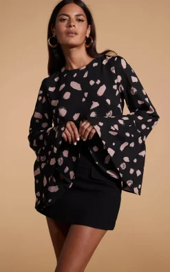 Suvi Flare Sleeve Top In Abstract Dot Sand On Black